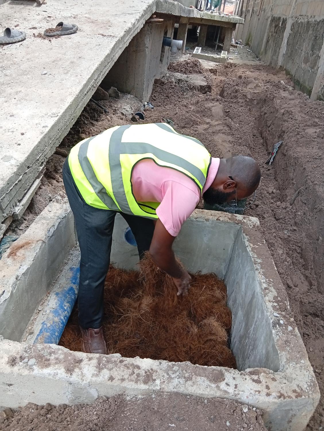 Technician working on biodigester